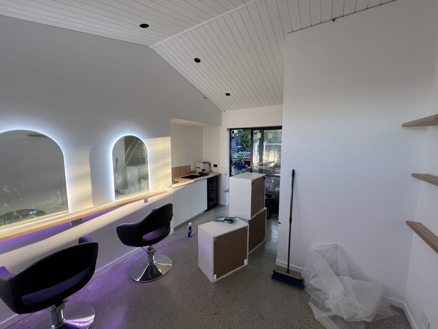 Interior of a commercial fit-out with recessed downlighting installed by Brady.