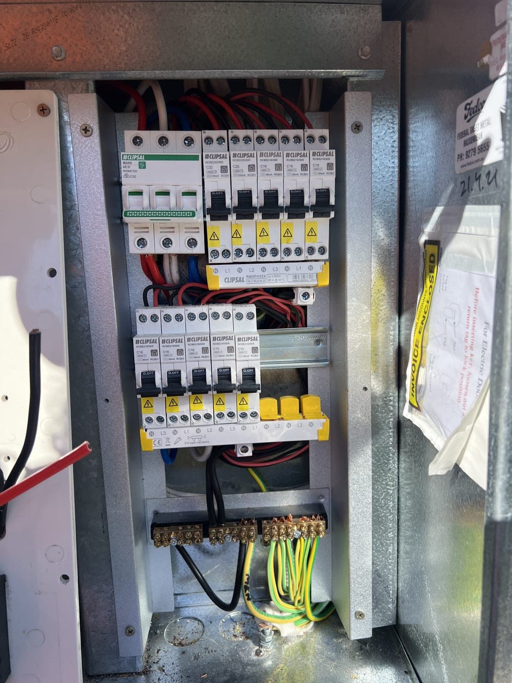 A neatly wired residential switchboard with new circuit breakers and metering.